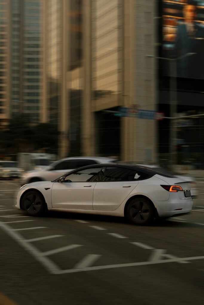 White Tesla Model 3 on Street in City which is the best electric car in australia