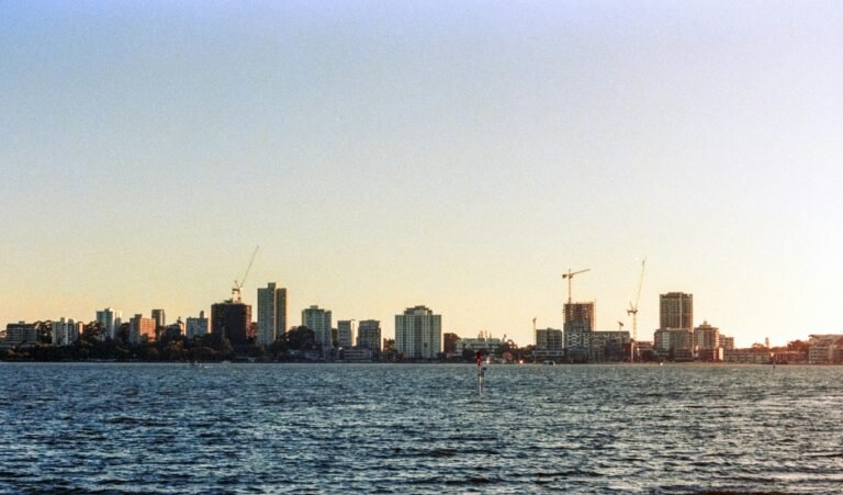 A large body of water with a city in the background