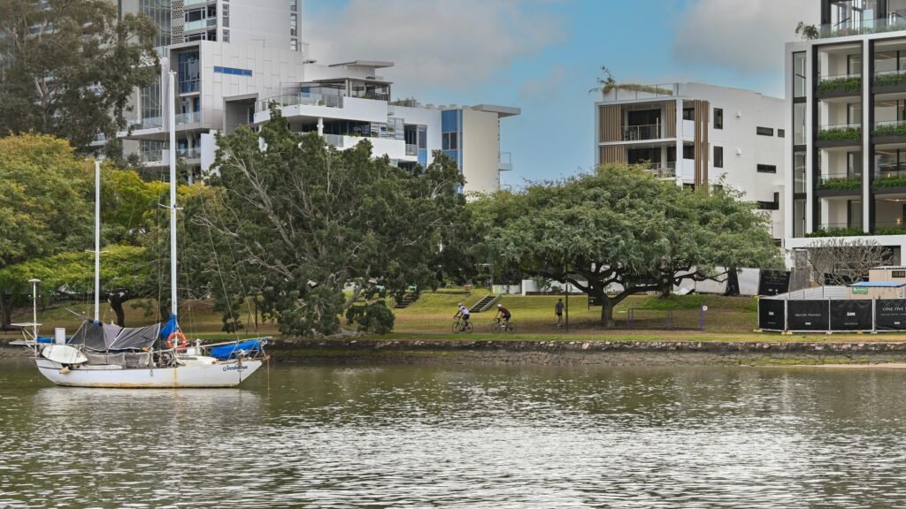 A boat is in the water near some buildings