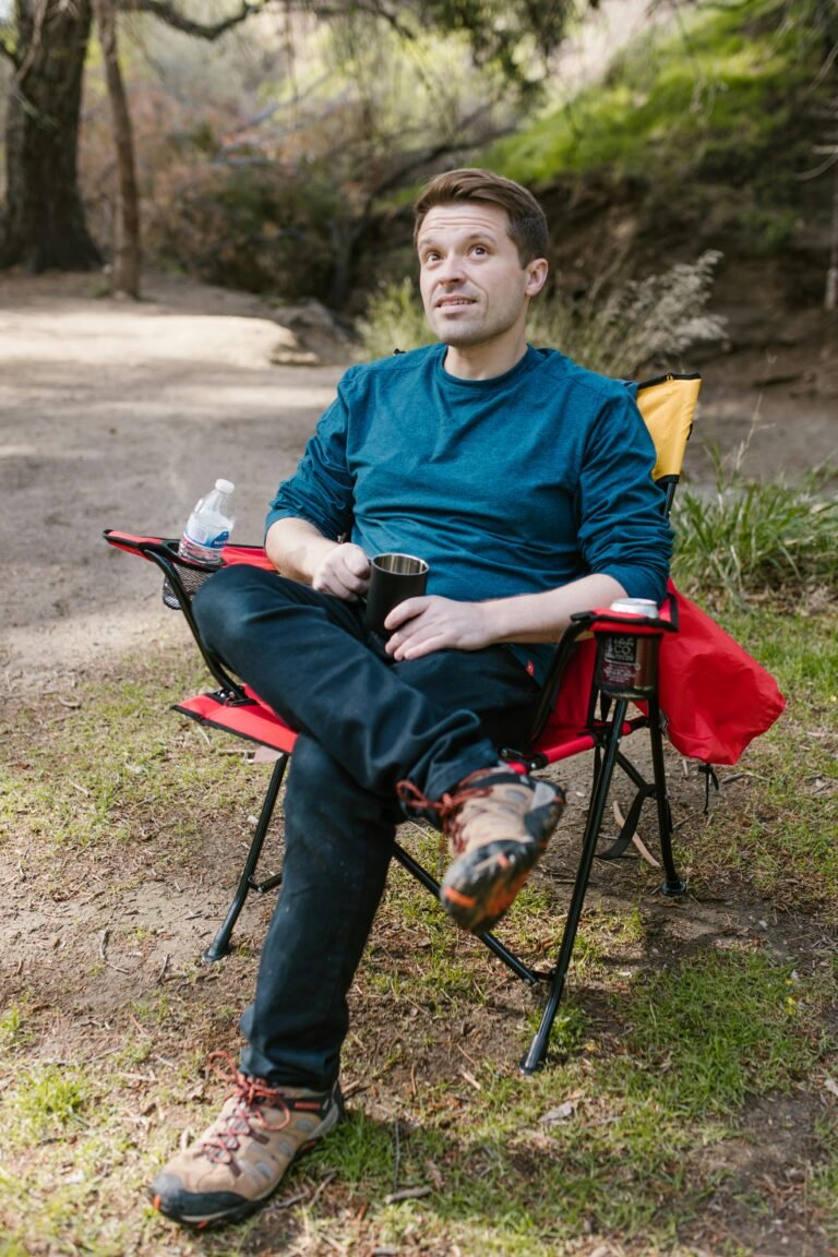 Photo of a Man Sitting on a Camping Chair